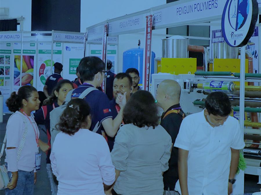 Visitors exploring exhibitor stands